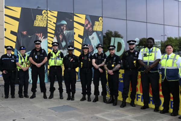 Walkden Neighbourhood Policing Team and security staff standing together outside Walkden Town Centre